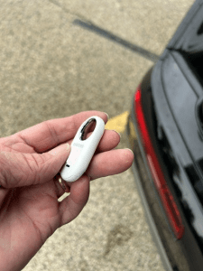 The side of a Samsung Tracker we discovered hidden in a customer's car on 5/13/2026